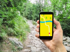 hiker using smartphone gps on travel hike living healthy active. All screen content is designed by me and not copyrighted by others and created with wacom tablet and ps